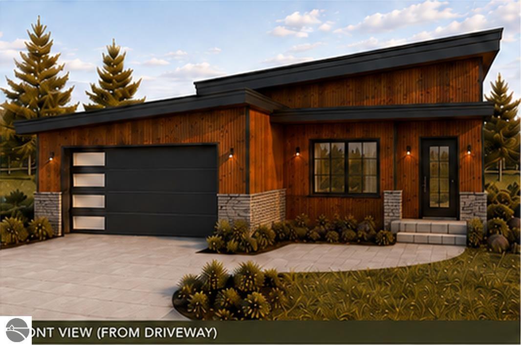 Modern wood-sided home with an angular roof, attached garage, and paved driveway.