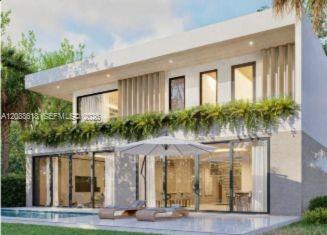 Modern two-story home with a planted balcony, expansive glass doors, and a poolside patio umbrella.