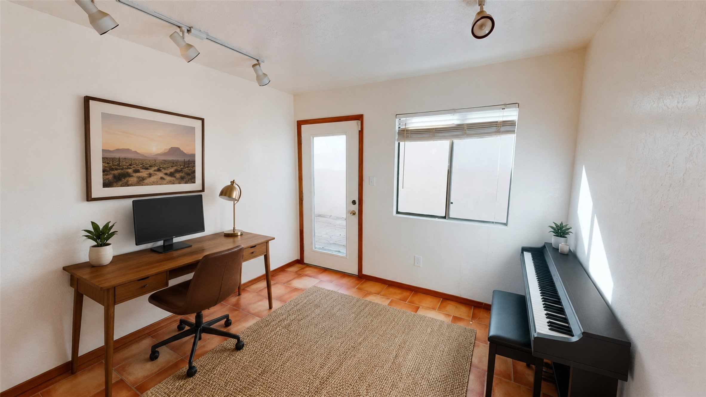 Home office with a wooden desk, electronic piano, and terracotta tile floor