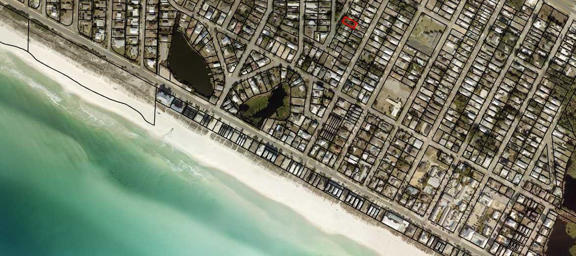 Aerial map of beachfront parcels, with one inland lot outlined in red.