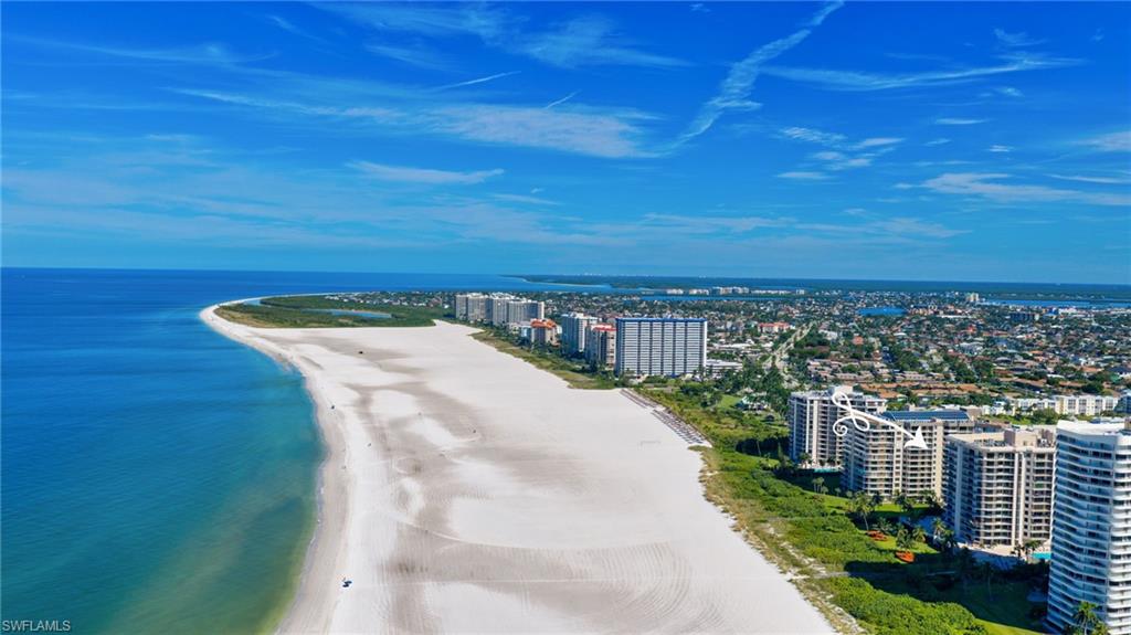 Aerial view of Marco Island beach and Gulf shoreline, with beachfront condominium towers.