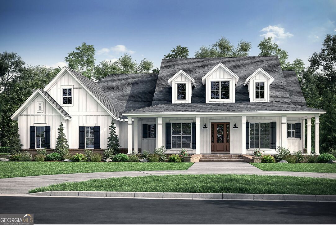 White farmhouse-style home with a covered porch, dormer windows, and landscaped front lawn.
