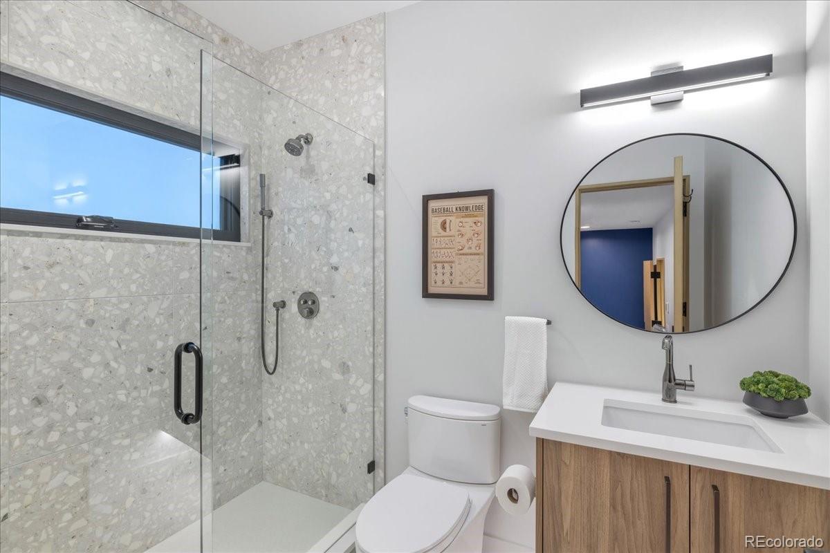  Bathroom with dual round mirrors and soaking tub