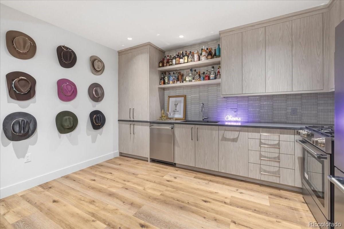  Bonus room with kitchenette and wall-mounted display shelving