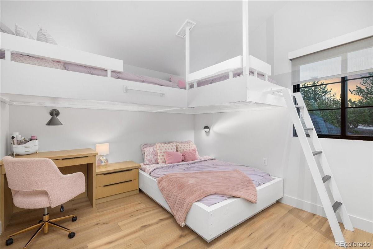 Kids bedroom with loft bunk bed and study desk