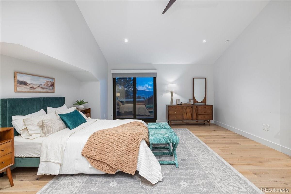  Bedroom with neutral tones and mountain view window