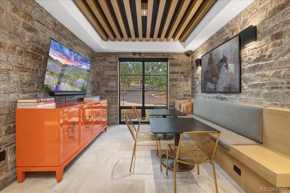 Media lounge with built-in seating and mounted televisions