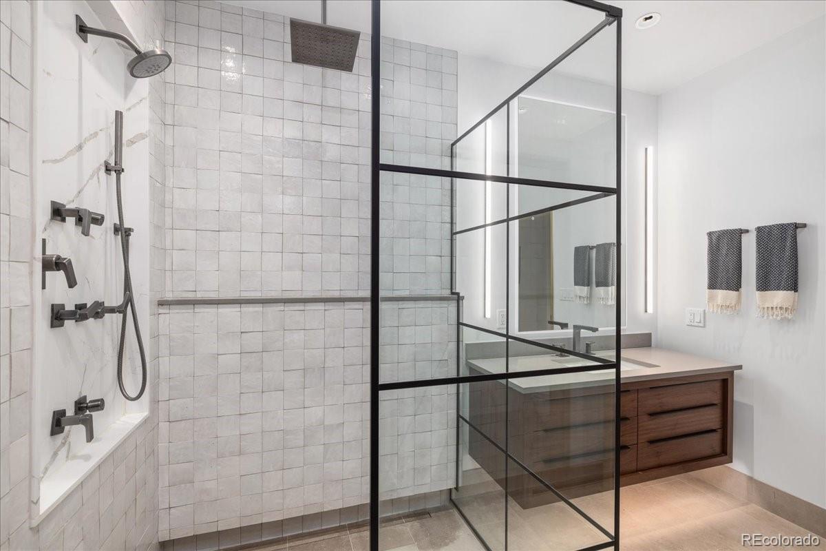 Tiled walk-in shower with dual shower heads