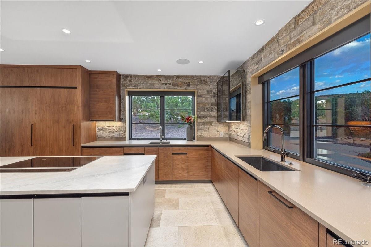 Kitchen sink area with mountain view window