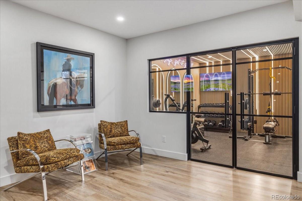 Home gym with glass-enclosed walls, Castle Rock wellness retreat