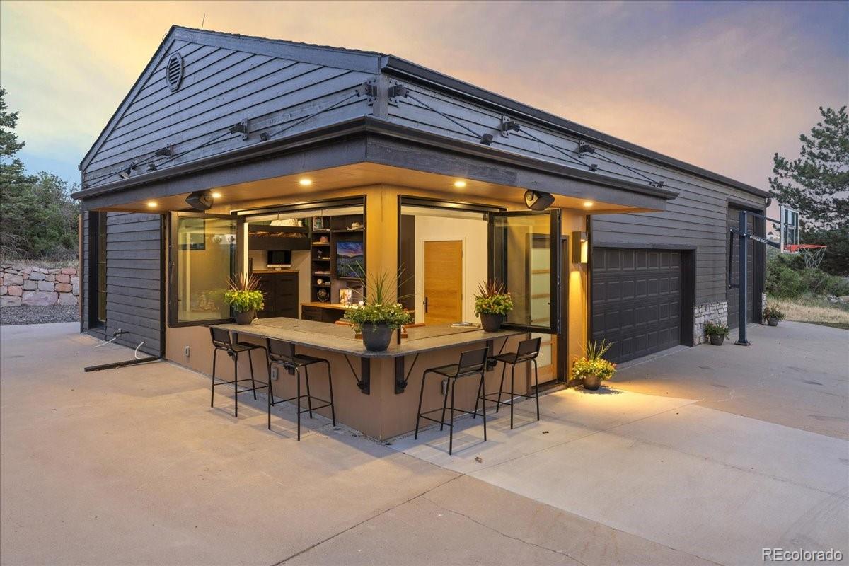 Carriage house exterior at dusk, Bear Canyon Ranch