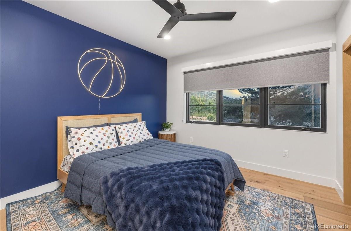Blue guest bedroom with basketball-themed decor