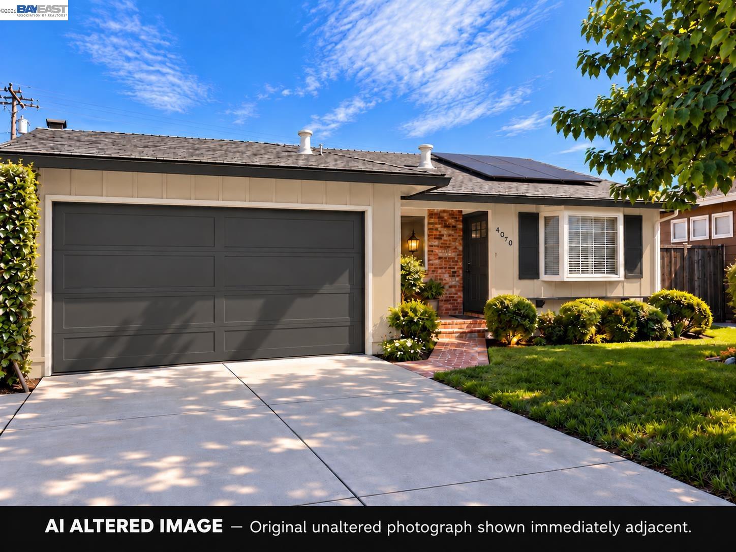Front exterior of 4070 Duggan Dr, with a wide charcoal garage door and rooftop solar panels.