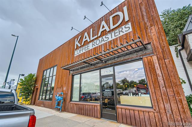 Kaladi Coffee Roasters storefront with a rust-colored wood facade and large windows.