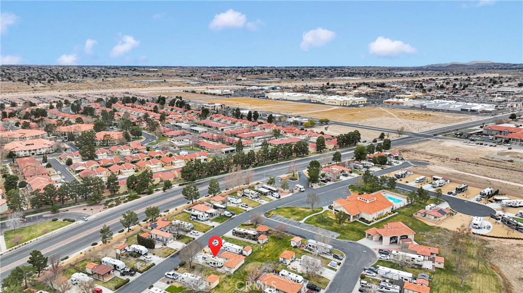 Aerial view of the Wedgewood Drive property, marked with a red pin among homes and recreational vehicles.