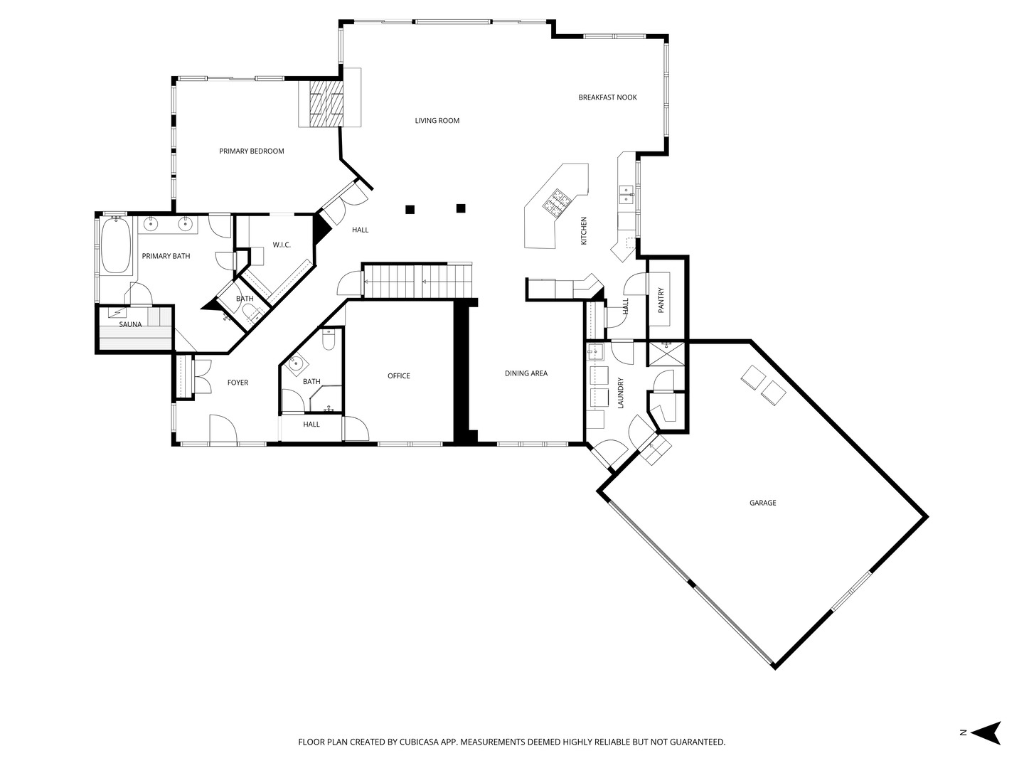 Floor plan showing the home’s rooms, including a sauna, office, and large garage.
