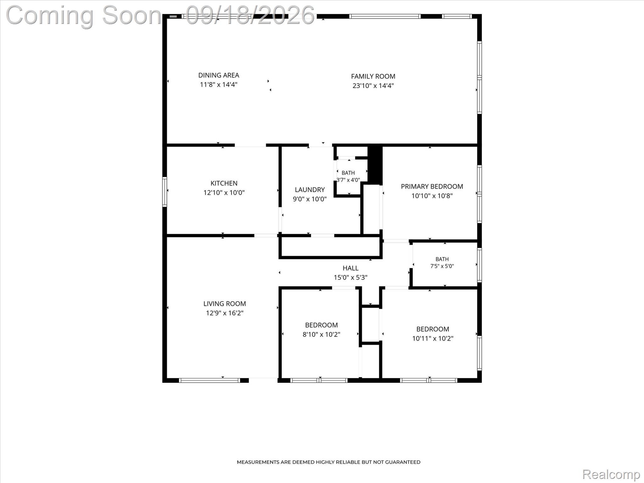 Floor plan showing a kitchen, living and family rooms, three bedrooms, laundry, and two baths.