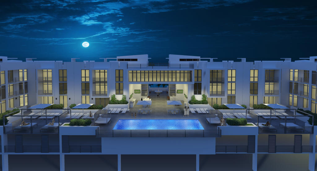 Modern condominium courtyard with a central swimming pool and terraces at night.