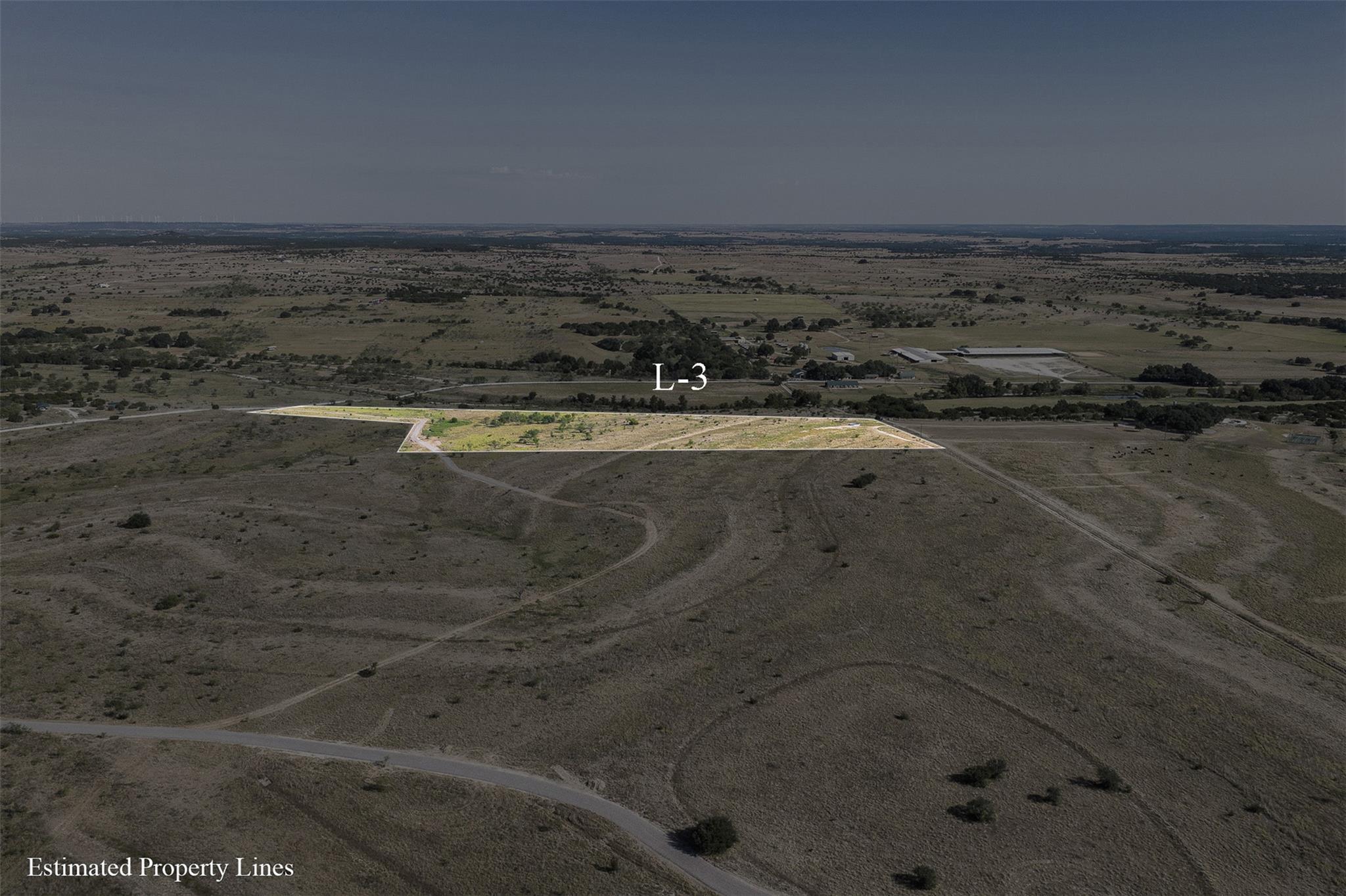 Aerial view of Lot L3, outlined in white amid dry scrubland and rural roads.