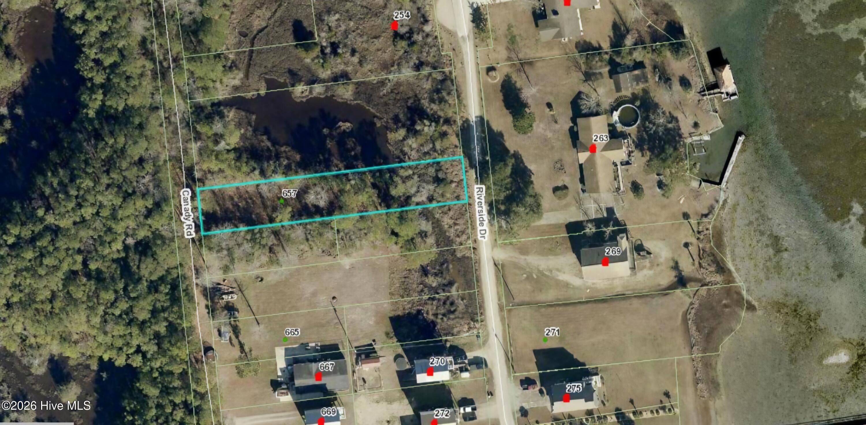 Aerial view of wooded parcel 657 outlined in turquoise beside Canady Road and Riverside Drive.