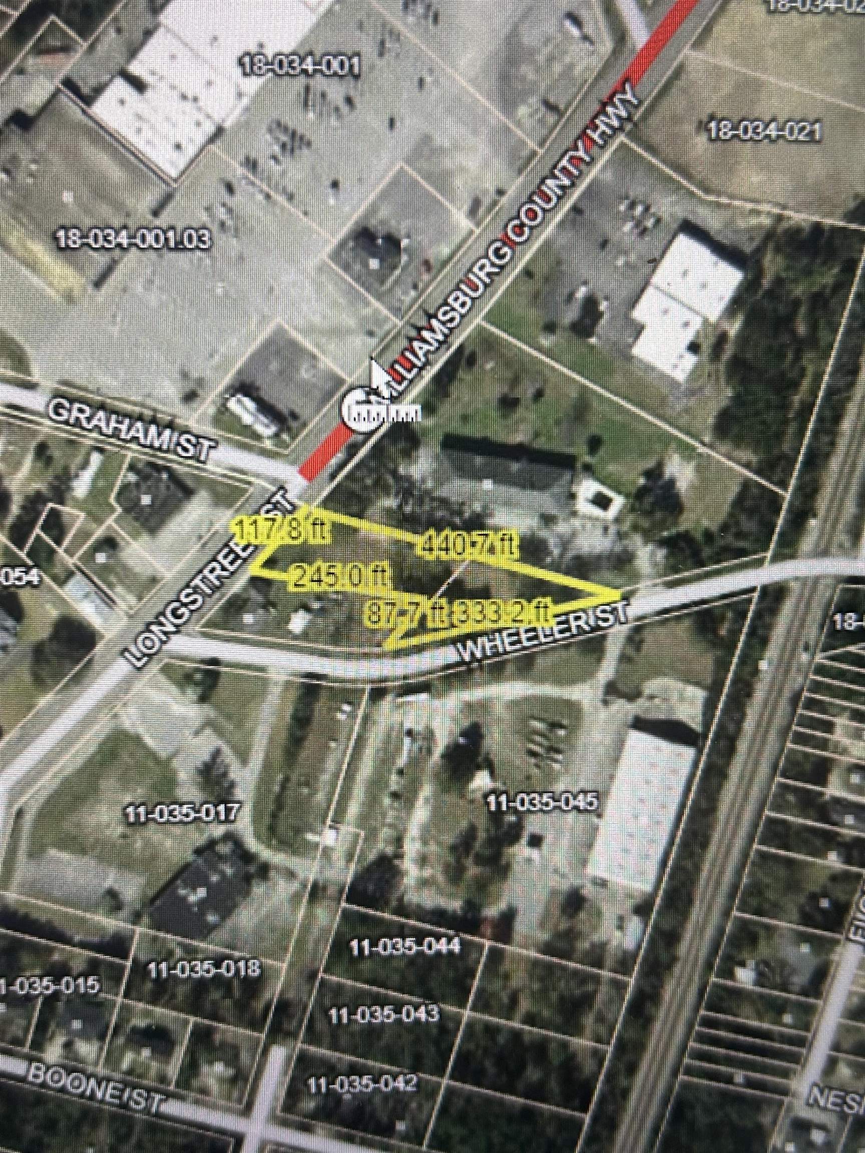 Aerial parcel map highlighting a lot at Longstreet and Wheeler streets with boundary dimensions.