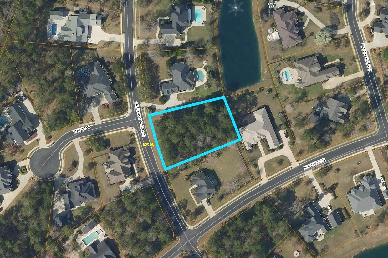 Wooded vacant lot outlined in blue between Creek Harbour Circle and Nautilus Drive.