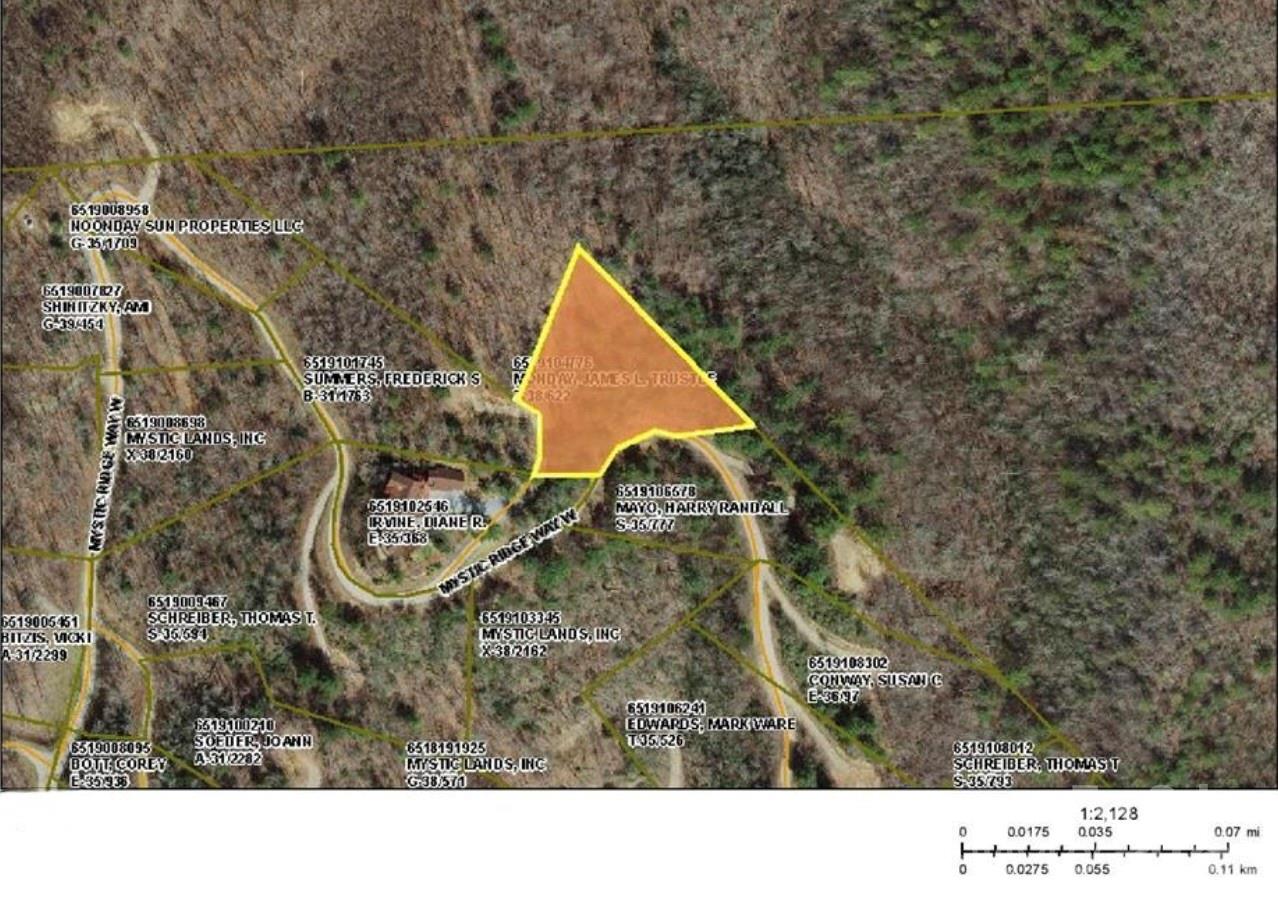 Aerial parcel map highlighting an irregular wooded lot in orange beside Mystic Ridge Way.