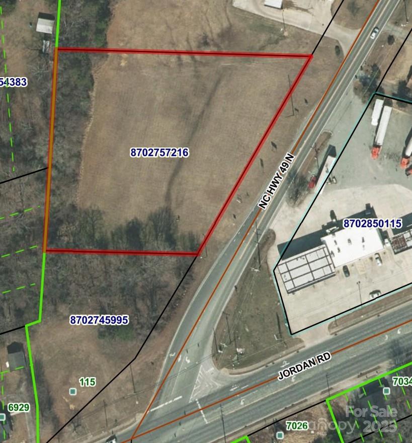 Aerial view of a vacant parcel outlined in red along NC Hwy 49 N near Jordan Rd.
