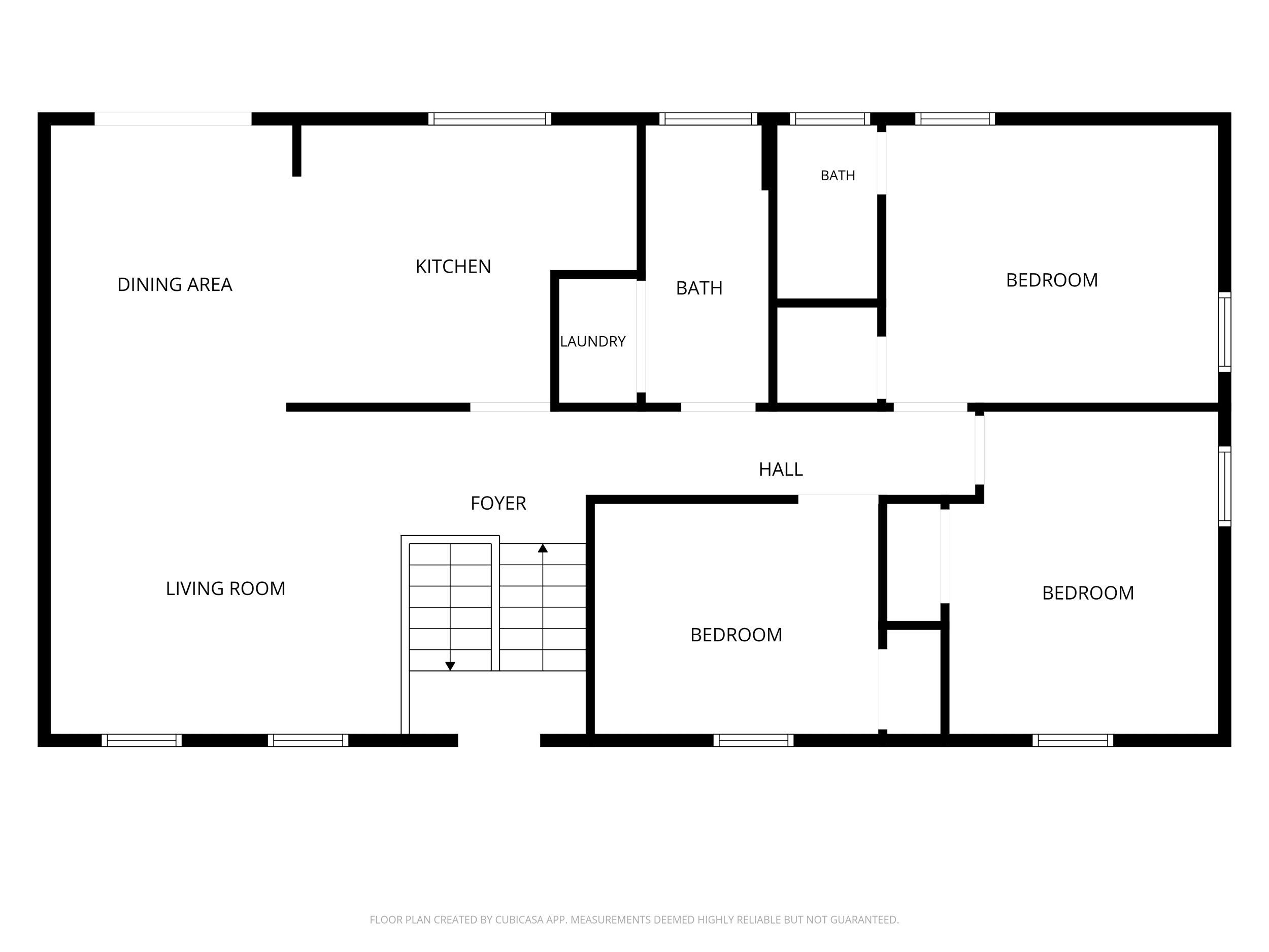 Floor plan showing three bedrooms, two bathrooms, kitchen, dining area, living room, laundry, foyer, and hall.