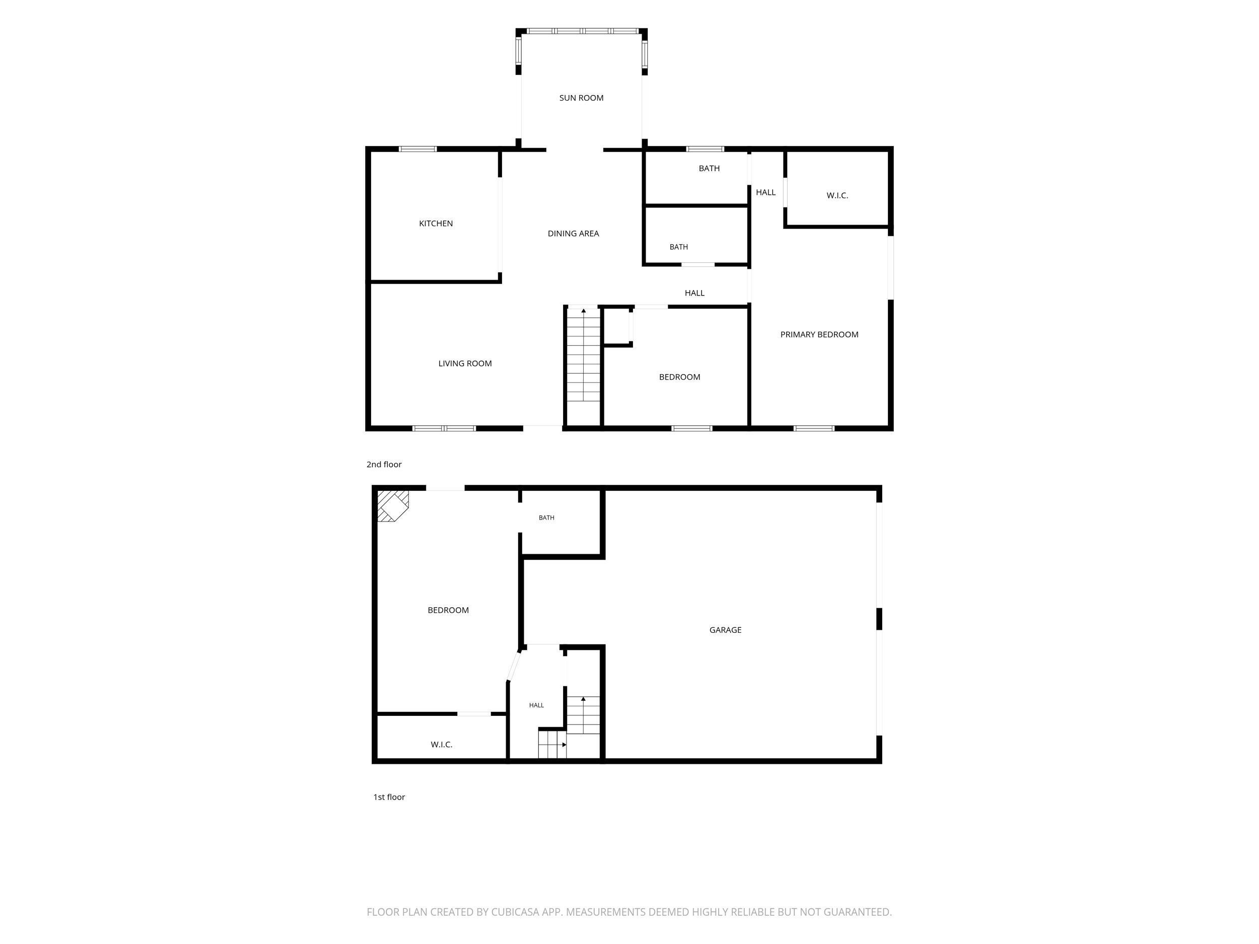 Two-level floor plan with a sun room, multiple bedrooms, and a large first-floor garage.