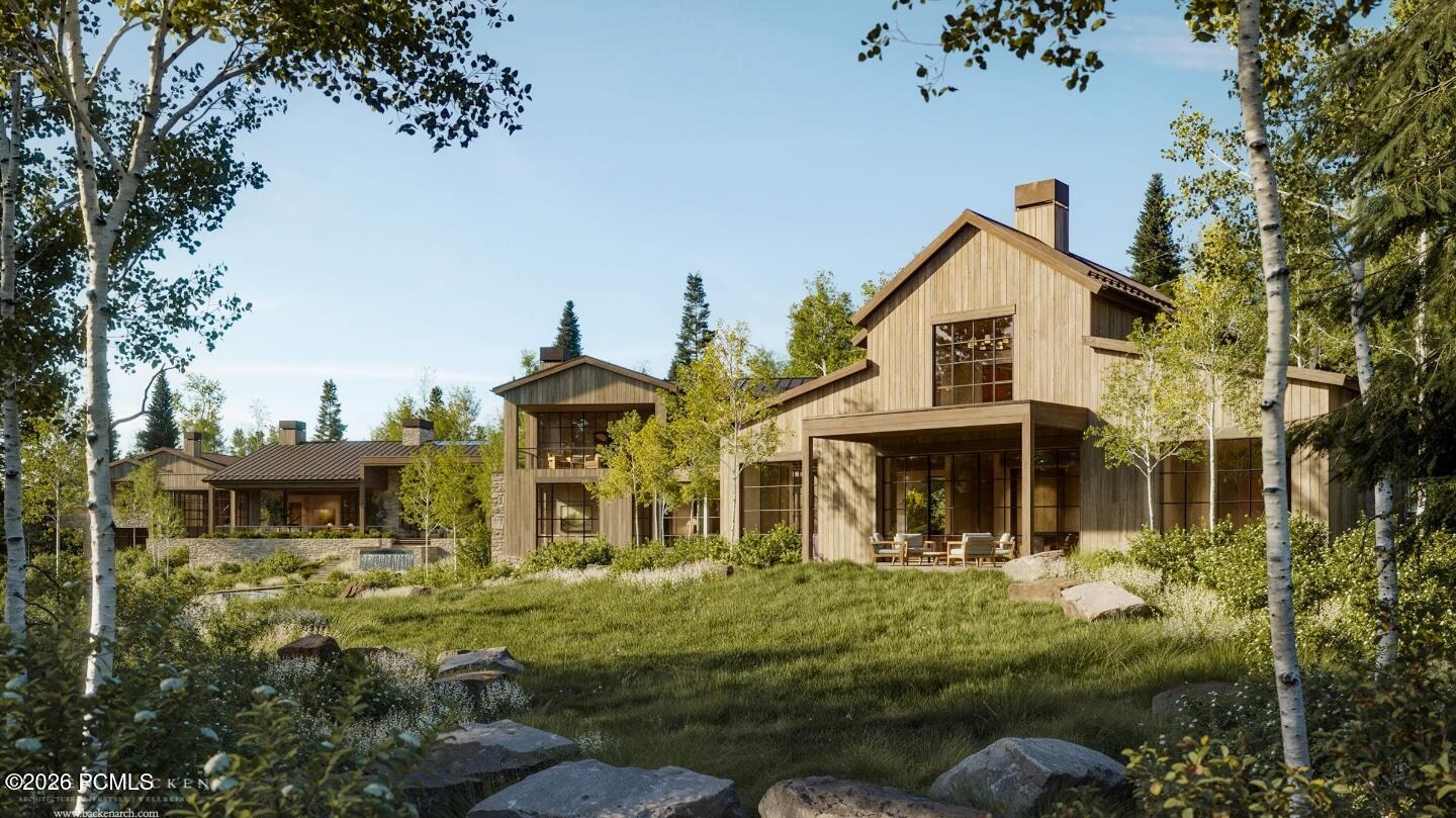 Contemporary wood-clad homes among aspens, with large windows and landscaped grounds.