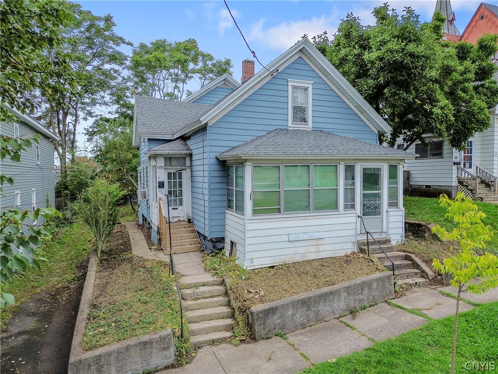 Blue house with a white enclosed porch and concrete steps at 155 Sherwood Avenue.