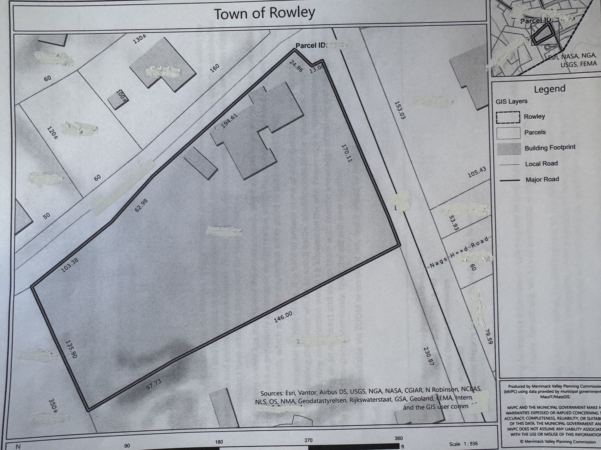 Parcel map showing a large outlined property, building footprints, boundary measurements, and nearby Nags Head Road.