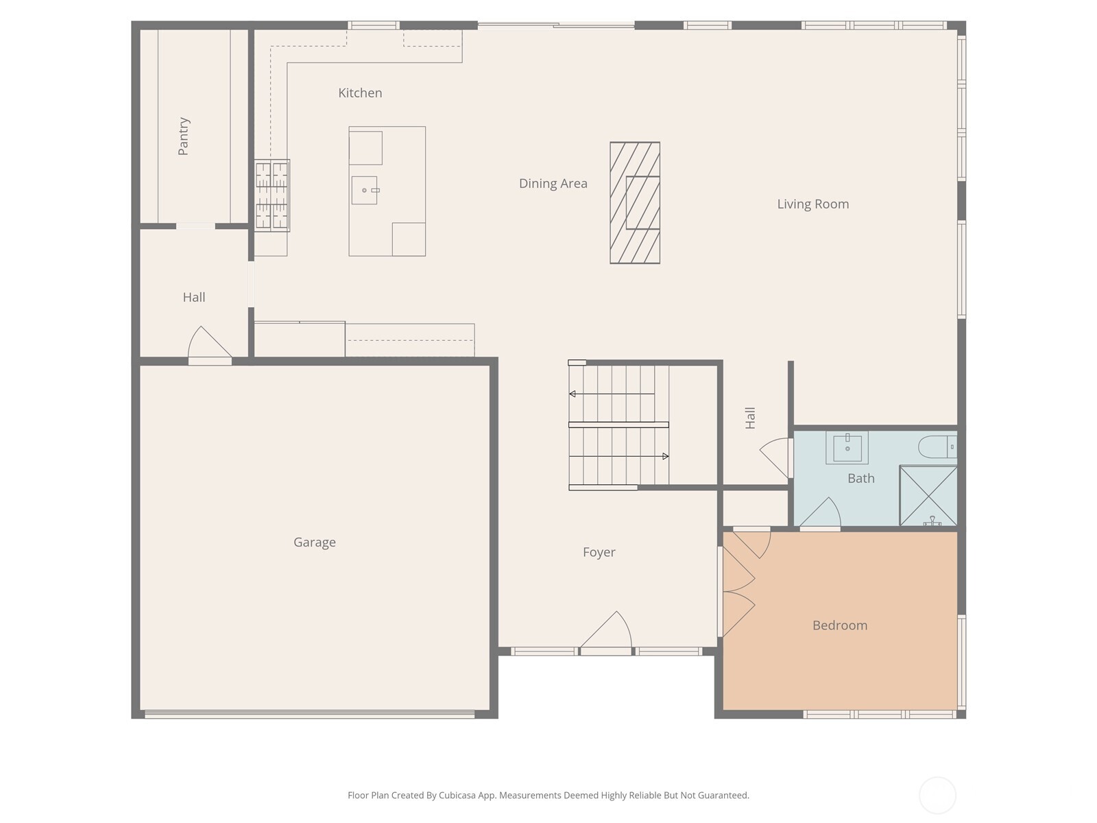 Floor plan showing kitchen, dining and living areas, garage, bedroom, bath, and foyer.
