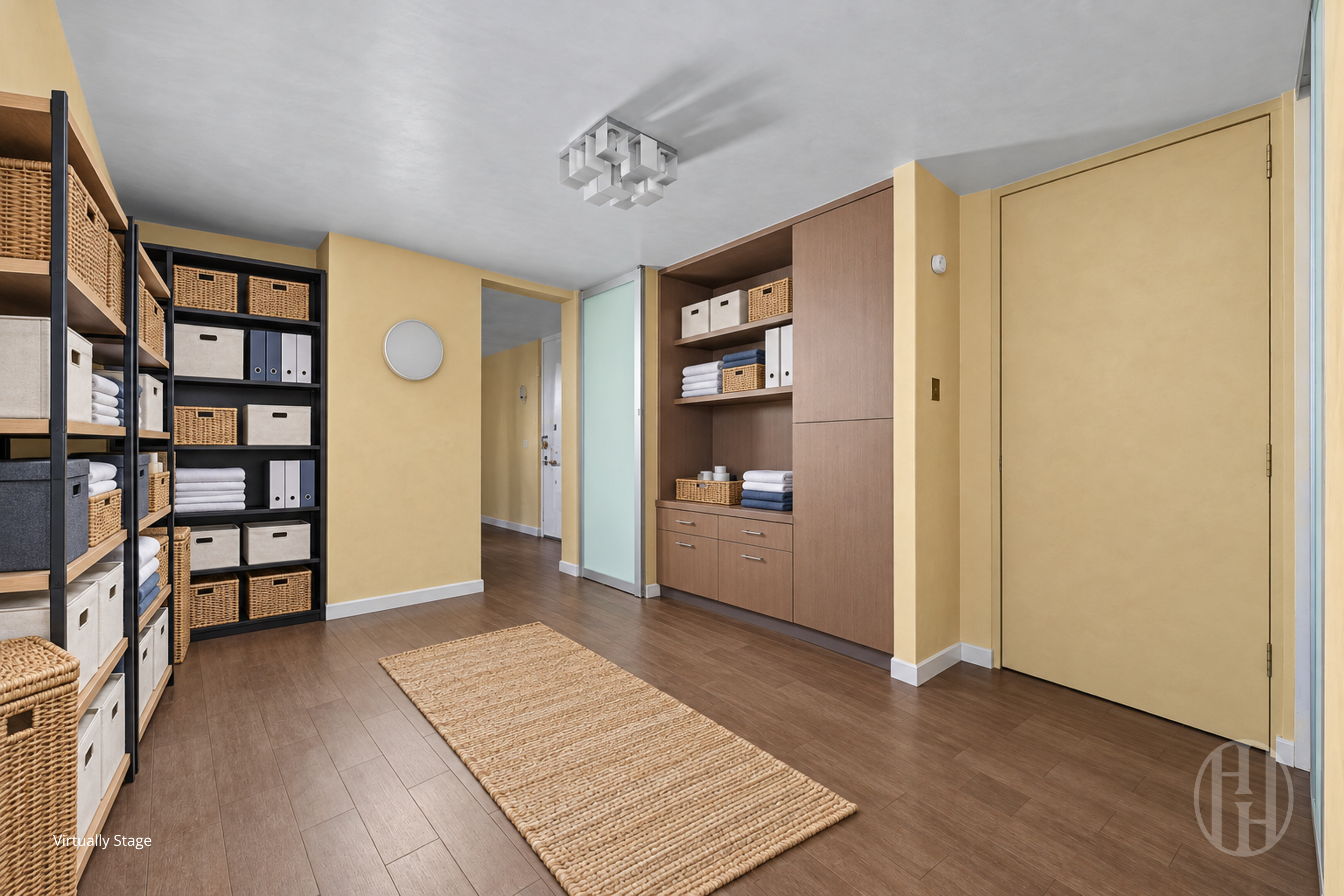 Apartment entryway with extensive basket-filled shelving, built-in cabinetry, and a woven runner.