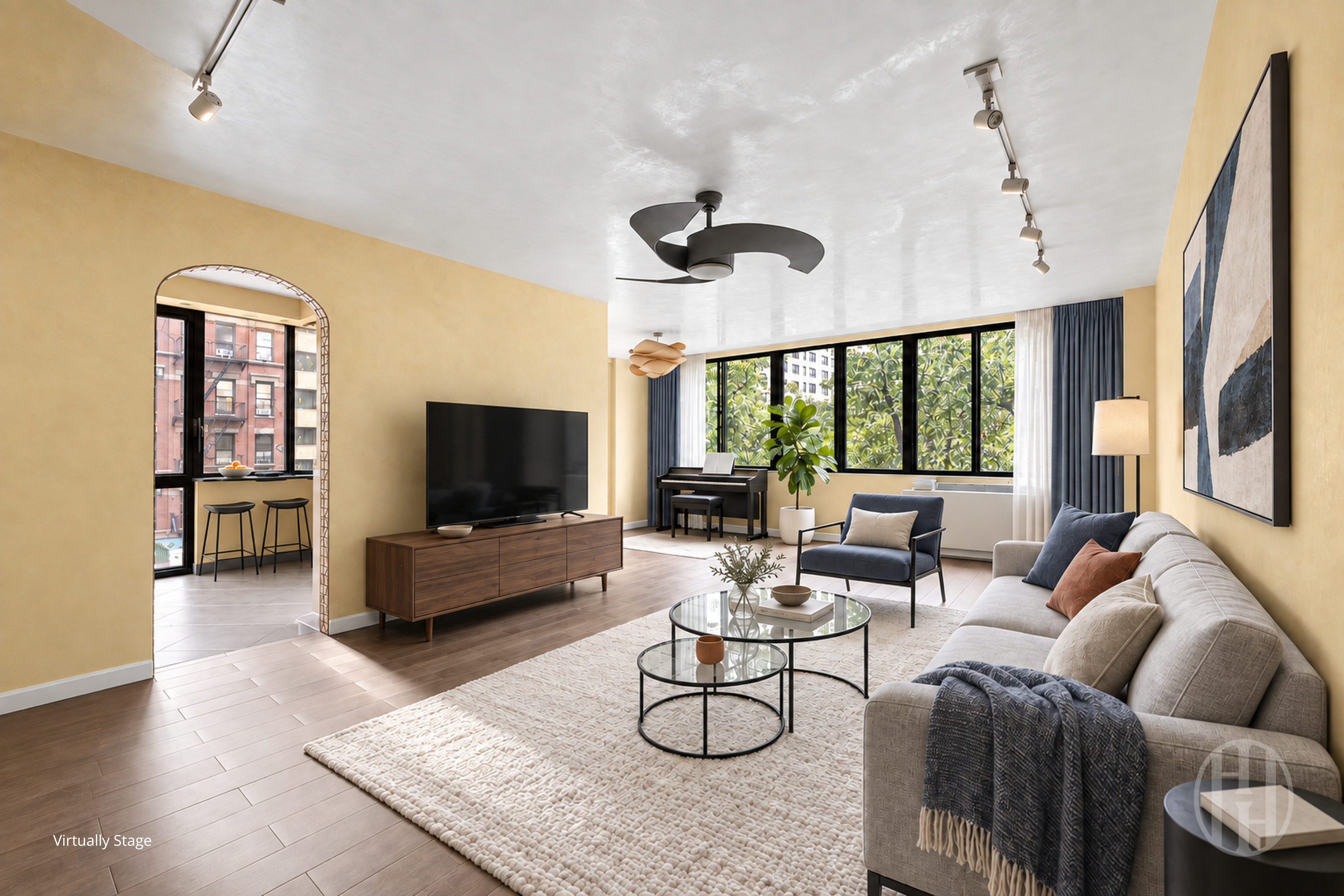 Virtually staged living room with yellow walls, large leafy windows, and a cream sofa.