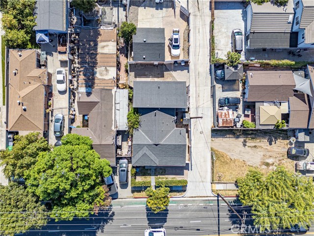 Aerial view looking straight down onto a suburban residential property and its surrounding neighborhood