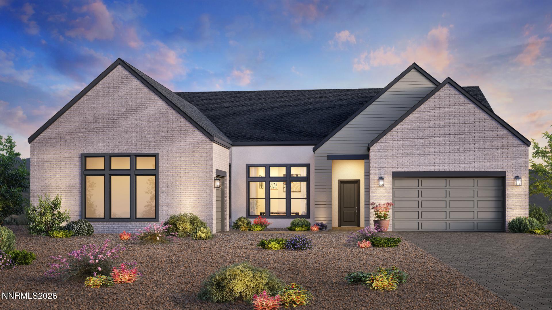 Single-story brick home with a two-car garage and landscaped front yard at dusk.