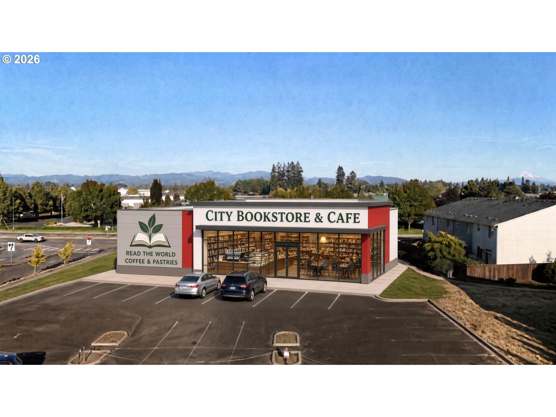 Bookstore and cafe with a glass storefront, parking lot, and distant mountain views.