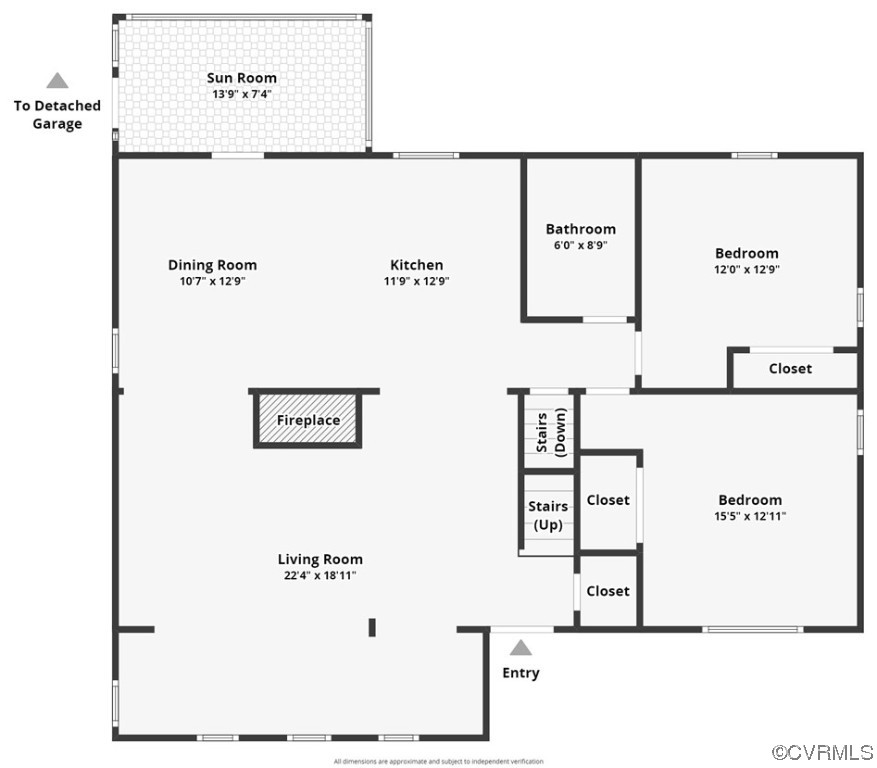 Floor plan showing two bedrooms, living and dining rooms, kitchen, sun room, fireplace, and detached garage access.