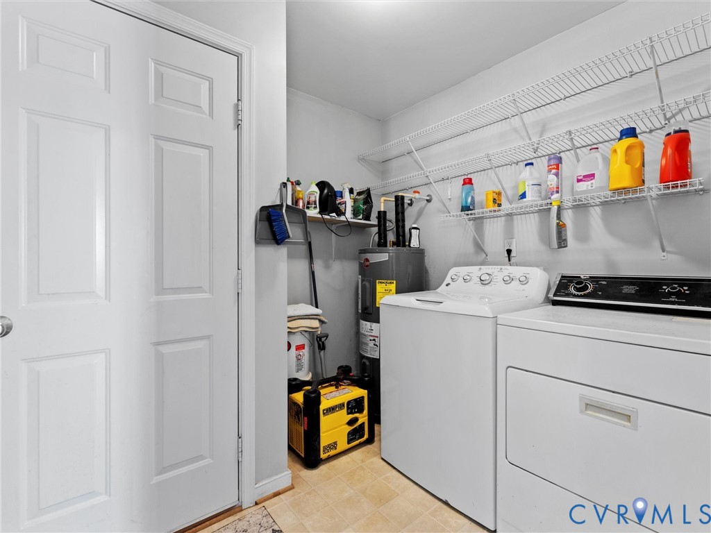 Laundry room with washer, dryer, stocked wire shelves, and a portable generator.