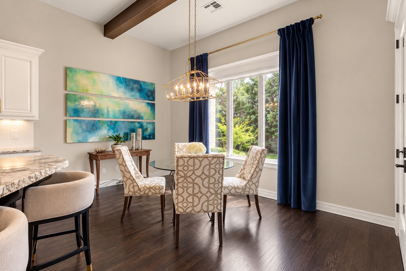Dining area with a glass-top table, patterned chairs, navy curtains, and dark hardwood floors.