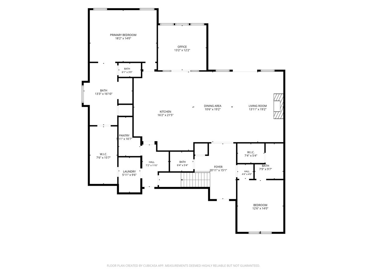 Floor plan with labeled rooms and dimensions, including a primary bedroom, office, kitchen, and living area.