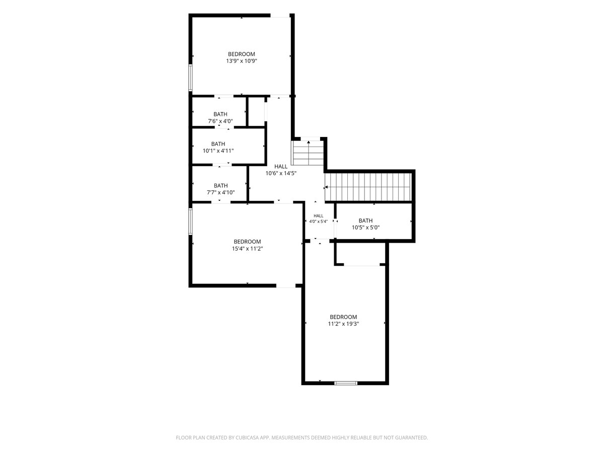 Floor plan showing three bedrooms, four bathrooms, two halls, and a staircase.
