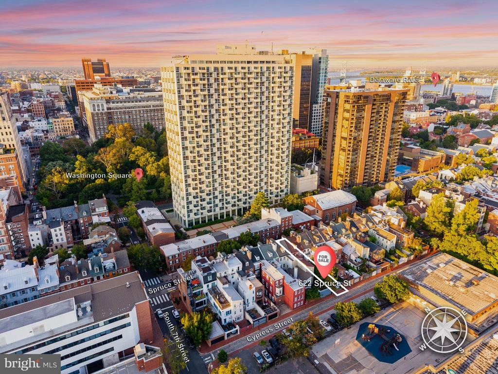 Aerial view of 622 Spruce Street, marked for sale amid Philadelphia buildings near Washington Square and the Delaware River.