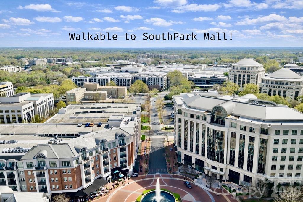 Aerial view of SouthPark Mall and surrounding buildings, with a central plaza and fountain.