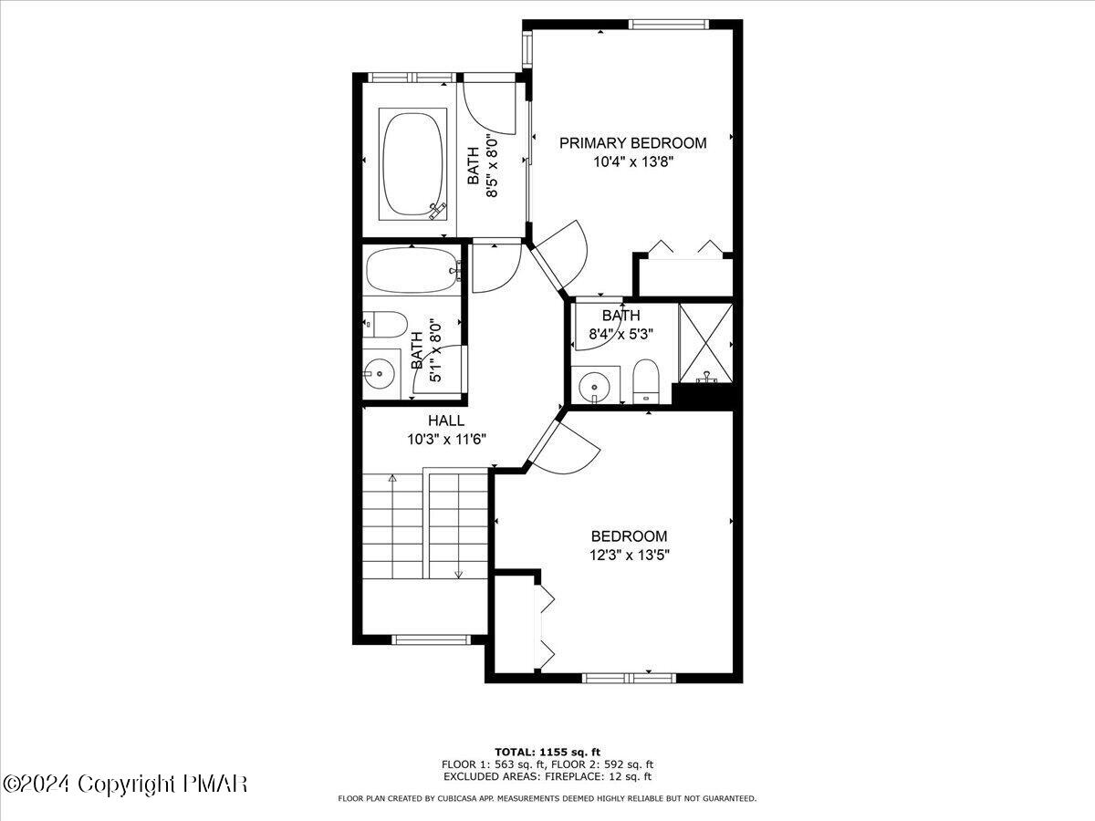 Floor plan showing a primary bedroom, bedroom, hall, three bathrooms, and stairs.