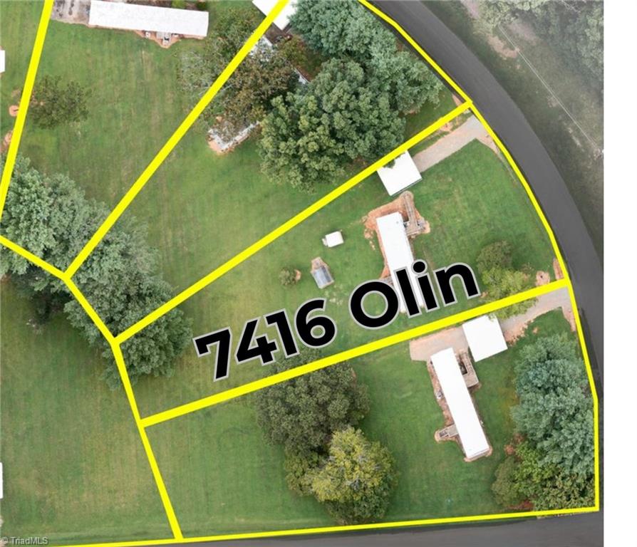 Aerial view of 7416 Olin Road showing yellow parcel boundaries, lawns, mature trees, and buildings.