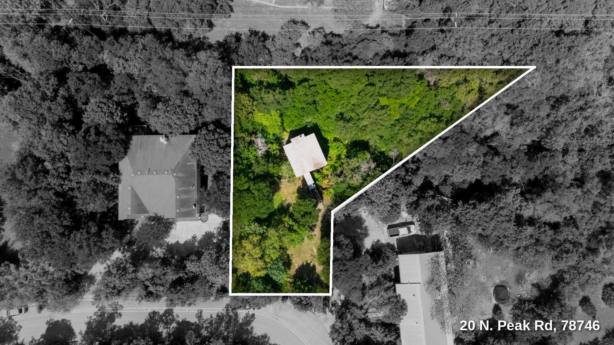 Aerial view of wooded property at 20 N. Peak Rd, with its boundary outlined in white.