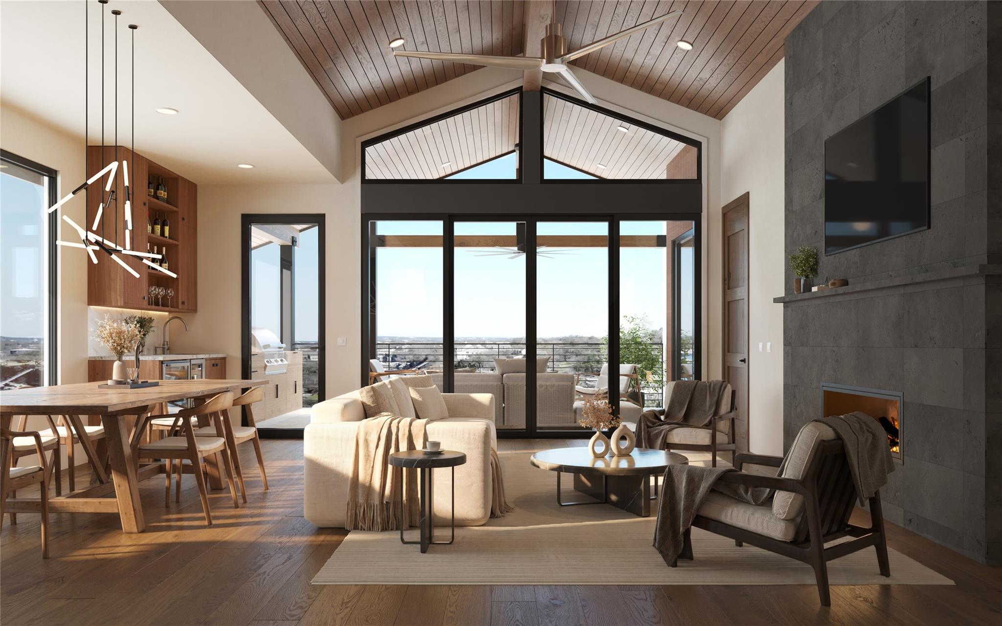 Open-plan living and dining room with a vaulted wood ceiling, glass doors, and a stone fireplace.